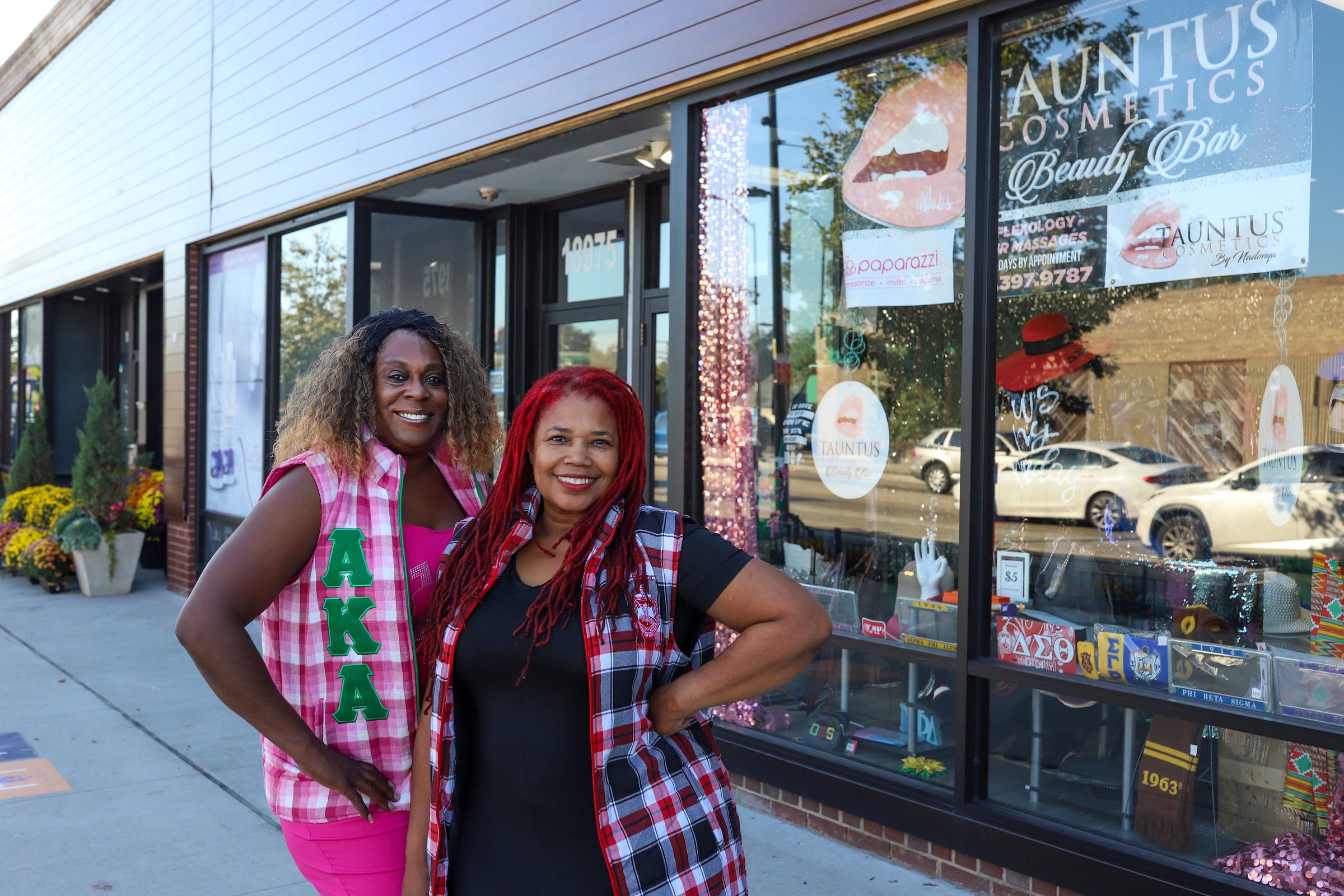 Dennae Hawkins (left) and Nadonya Muslim, co-owners of Tauntus Beauty Bar, the only store in Detroit that is licensed to sell "Divine Nine" clothing and other items, as they appeared on Oct. 3, 2023. Hawkins and Muslim have been making preparations to stock their store with enough items to meet the demands of customers seeking merchandise connected to the presidential election and Kamala Harris campaign.