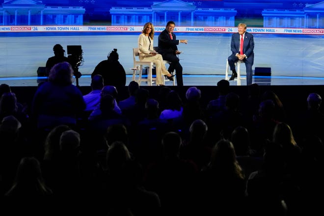 Des Moines, Iowa |
Former President Donald Trump speaks with an audience member at the Fox News town hall at the Iowa Events Center on Jan. 10, 2024, in Des Moines, where a mostly friendly crowd asked him very few challenging questions.
Trump talked about the economy and criticized Republican presidential candidate rivals Nikki Haley and Ron DeSantis.