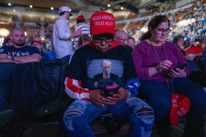 Harrisburg, Pennsylvania |
At the NRA Presidential Forum at the Great American Outdoor Show on Feb. 9, 2024, supporters wait to hear former President Donald Trump speak. Attendees were decked out in Trump gear, including images of his mugshot, pictured here on a T-shirt. 

His mugshot was publicly released shortly after he was booked at an Atlanta jail on charges that he attempted to overturn the results of the 2020 election in Georgia.

Though Trump faces multiple charges in three other pending criminal cases, the Aug. 14 indictment brought by Fulton County District Attorney Fani Willis was the first time officials required he submit to a photograph.