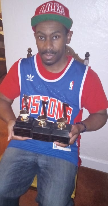 Sitting pretty in his northwest Detroit home, wearing an Isiah Thomas Detroit Pistons jersey, the artist known as Leaf Erikson is in his Detroit element, as he holds three Detroit Music Awards that have been presented to him by the Detroit Music Awards Foundation.