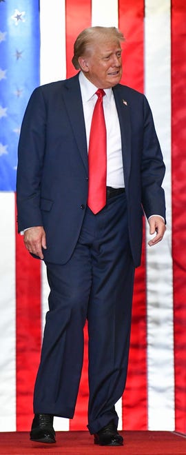 Former President Donald Trump walks onstage at a campaign rally on July 27, 2024 at the Herb Brooks National Hockey Center in St. Cloud, Minnesota. In his speech, Trump called on his supporters to flip the state red.