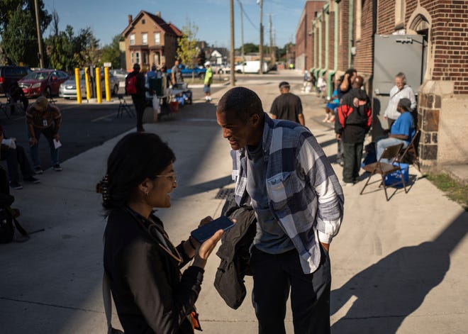 Dr. Shaina Shetty of the Community Health and Social Services speaks with Daniel Lewis, 60, of Detroit, while doing street medicine outreach on Monday, August 12, 2024, at Manna Community Meals in Detroit's Corktown neighborhood. CHASS recently received $562,868 in American Plan Act dollars to expand its street medicine team, to aid people experiencing homelessness on the streets taking medical care right to the people who need it.