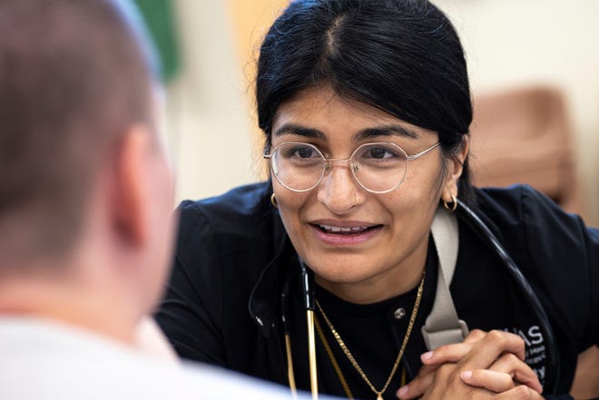 Community Health and Social Services family medicine physician Dr. Shaina Shetty speaks with Krystal Arzadon, 29, of Detroit, during a stop to the Capuchin Soup Kitchen in Detroit while doing a street medicine outreach on Monday, August 12, 2024. CHASS recently received $562,868 in American Plan Act dollars to expand its street medicine team, to aid people experiencing homelessness on the streets taking medical care right to the people who need it.